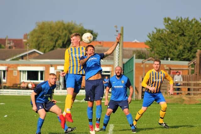 Jensen Bradbury beats Tony Pickles in the air
Photo by Alec Coulson