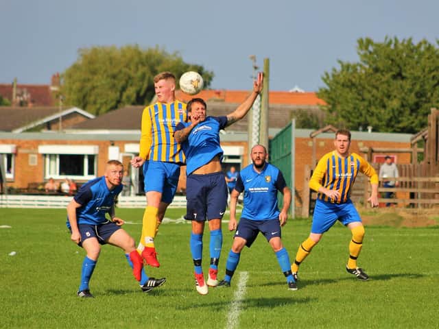 Jensen Bradbury beats Tony Pickles in the air
Photo by Alec Coulson