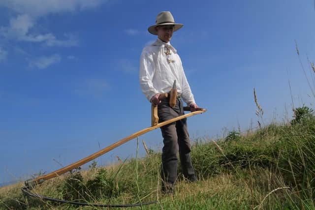 Martin Stevens cuts the meadow at RSPB Bempton Cliffs.