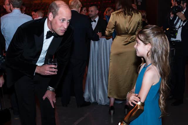 Prince William, Duke of Cambridge talks with Phoebe. (Photo by Arthur Edwards - WPA Pool/Getty Images)