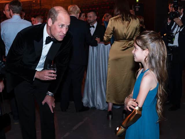 Prince William, Duke of Cambridge talks with Phoebe. (Photo by Arthur Edwards - WPA Pool/Getty Images)