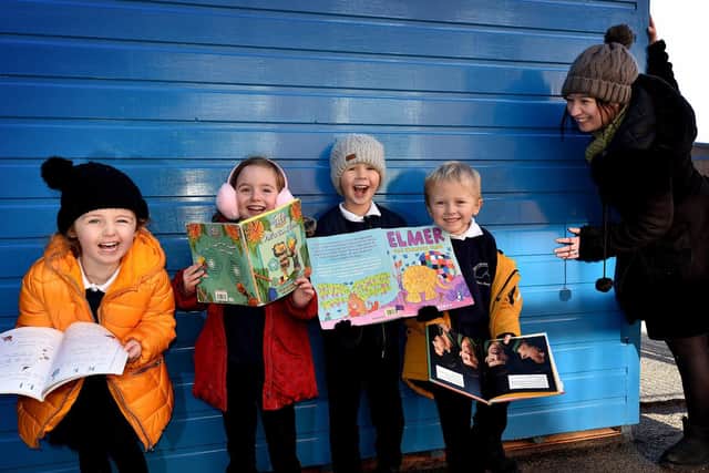 West Cliff school pupils pictured outside their reading area with Head Christina Zanelli.