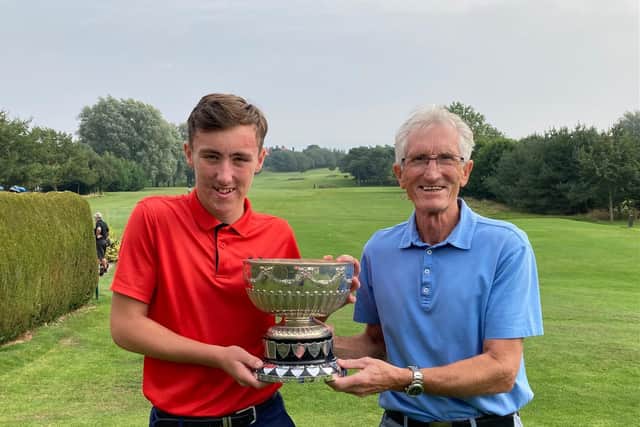 Josh Beecroft and grandad, Boro legend Harry Dunn with the silverware