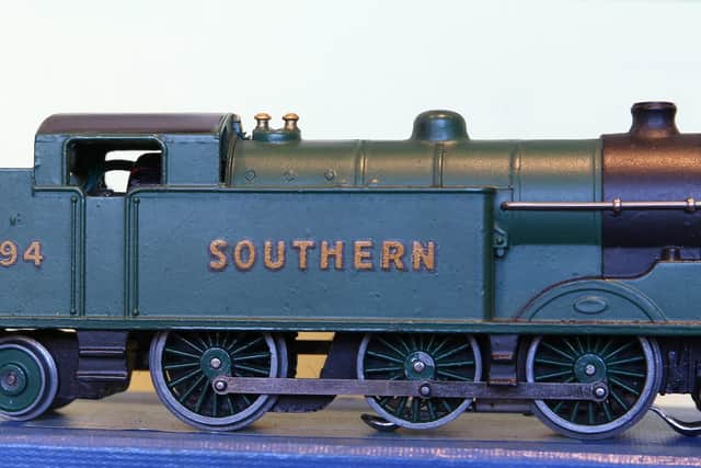 The malachite green colour of this tank engine quadruples its value.