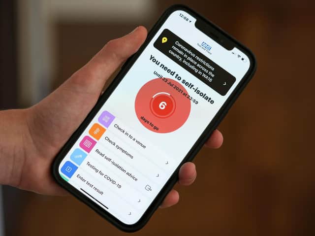The NHS Covid-19 App (Photo illustration by Christopher Furlong/Getty Images)