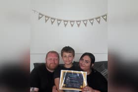 Eli Harrison of Staithes with his parents Ian and Kayleigh.
