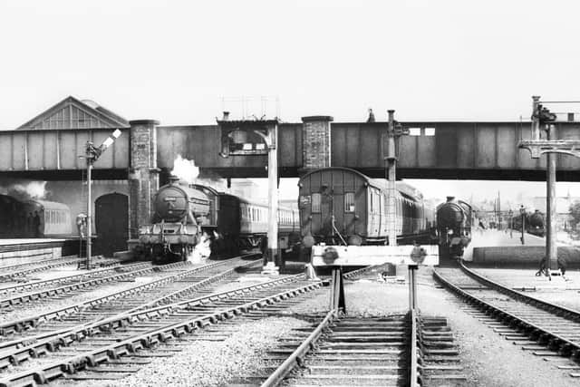 A busy scene in 1956 with 62745, The Hurworth, taking centre stage with a train departing from platform 4. In the shadows, under the original train shed roof, stands a train waiting to depart from platform 2. Photo: R Humm coll.