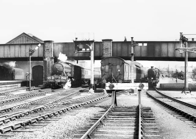 A busy scene in 1956 with 62745, The Hurworth, taking centre stage with a train departing from platform 4. In the shadows, under the original train shed roof, stands a train waiting to depart from platform 2. Photo: R Humm coll.
