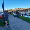 People watching the boat launch in Whitby.