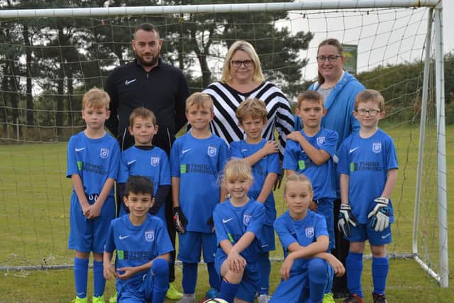 Heslerton Hounds U8s in their new team kit sponsored by Third Energy.