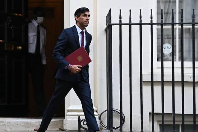 Britain's Chancellor of the Exchequer Rishi Sunak leaves 11 Downing street in central London on his way to parliament. (Photo by DANIEL LEAL-OLIVAS / AFP) (Photo by DANIEL LEAL-OLIVAS/AFP via Getty Images)