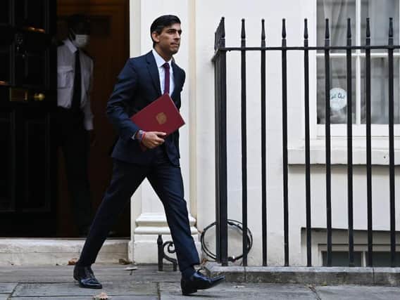 Britain's Chancellor of the Exchequer Rishi Sunak leaves 11 Downing street in central London on his way to parliament. (Photo by DANIEL LEAL-OLIVAS / AFP) (Photo by DANIEL LEAL-OLIVAS/AFP via Getty Images)