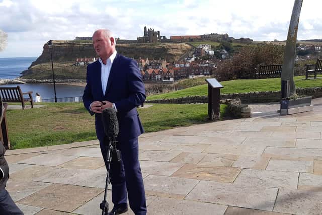 Paul Donovan talks to the press by Whitby whalebones.