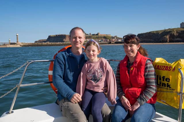Ross and Laura Crookes and their daughter Elizabeth, on board The Coastal Explorer.