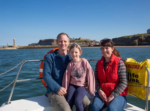 Ross and Laura Crookes and their daughter Elizabeth, on board The Coastal Explorer.