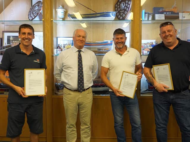 RNLI Chief Executive Mark Dowie presents L-R: Richard Dowson, Matt Sharpe and Ian Taylor with their framed letters of thanks. - Picture credit: 
RNLI/Leah Hunter