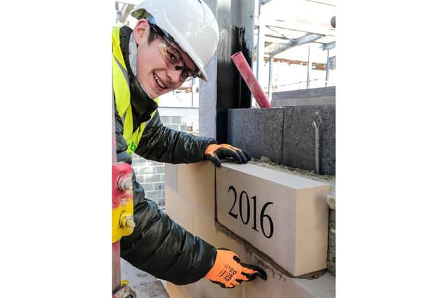Oscar Hartley lays the foundation stone of the new lifeboat station in 2016. (John Margetts)
