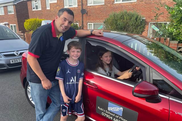 Whitby driving instructor Rob Anscombe with Ewan and Maddie.