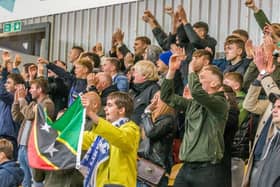 Whitby Town fans roar in appreciation during the FA Cup game at York City.

Photo by Brian Murfield