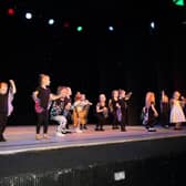 The Baby Butterflies join teacher Chanelle Colebrooke on stage.