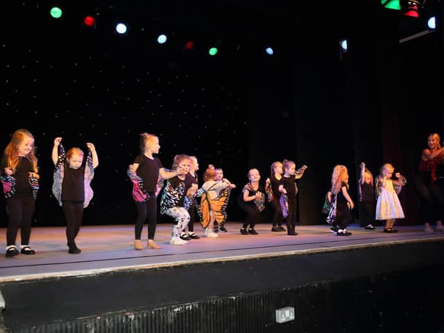 The Baby Butterflies join teacher Chanelle Colebrooke on stage.