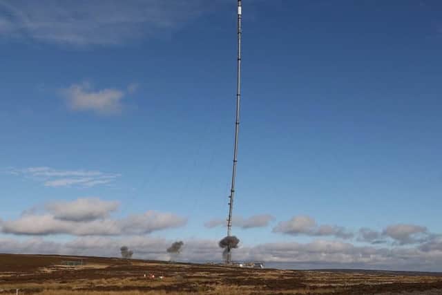The damaged TV mast at Bilsdale pictured being felled.