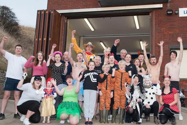 Brave swimmers get ready to enter the freezing water during the annual Flamborough Festive Dip on Boxing Day at South Landing in 2013. Do you recognise any of the people in the photograph? (msh1352y109)