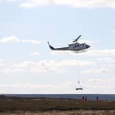 Helicopter lifting materials on to the site at Bilsdale prior to the temporary TV mast being put in.