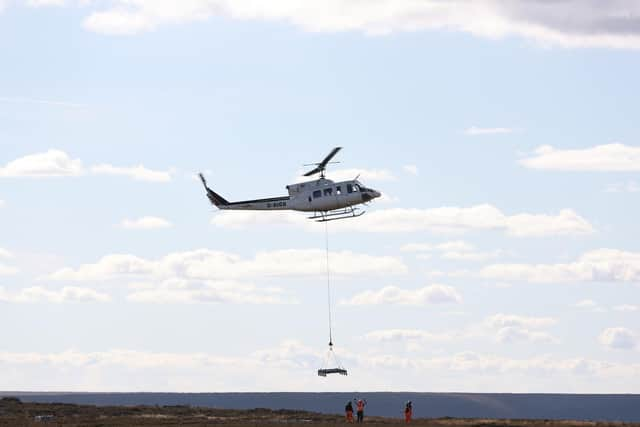 Helicopter lifting materials on to the site at Bilsdale prior to the temporary TV mast being put in.