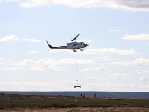 Helicopter lifting materials on to the site at Bilsdale prior to the temporary TV mast being put in.