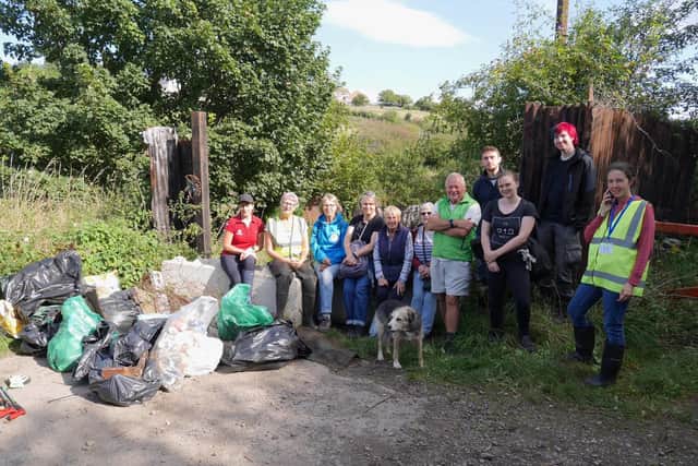 Volunteers with litter retrieved from Whitby's Calla Beck.