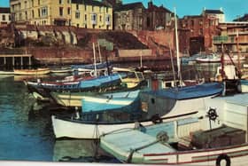 This postcard shows Bridlington Harbour in the 1960s.