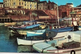 This postcard shows Bridlington Harbour in the 1960s.