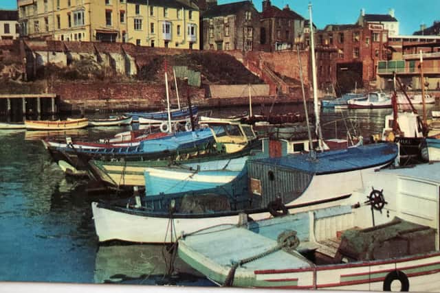 This postcard shows Bridlington Harbour in the 1960s.