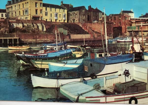 This postcard shows Bridlington Harbour in the 1960s.