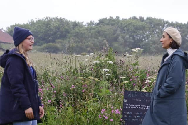 TV presenter Anita Rani meets staff at RSPB Bempton Cliffs. Photo courtesy of RSPB Images.