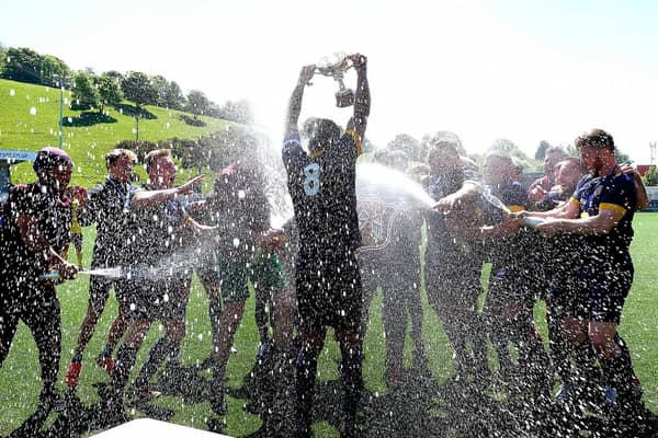 Angel celebrate their NRCFA Cup 4-1 final win against Traf in May