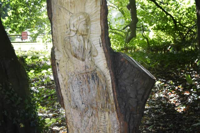 Woodcarver Allen Stichler has created a fairy tower, gnomes, a pixie baby, elves, fairies, a dragon and a unicorn.