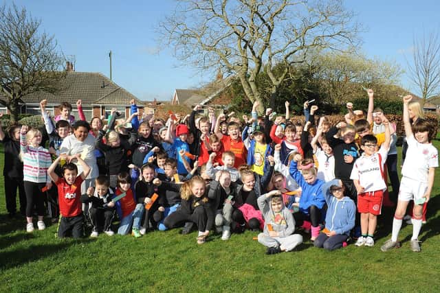 Burlington Junior School pupils are pictured before their Sport Relief mile run in 2014. (NBFP PA1412-13a)