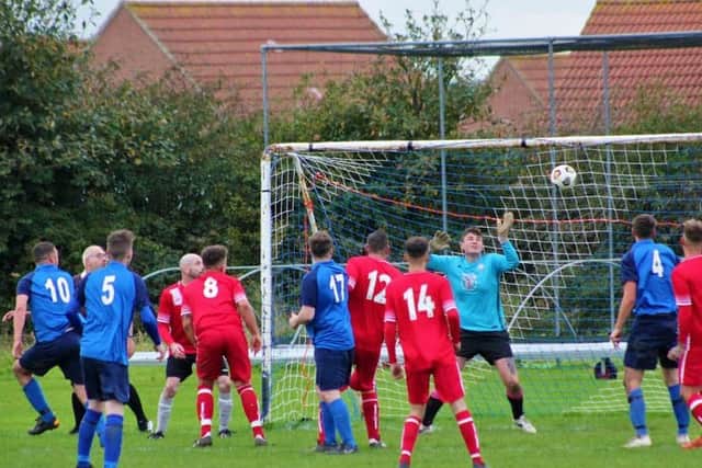 Andy Noon heads in the leveller for Edgehill Reserves in the final minute of their game at home to Newlands Reserves