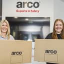 Anna Harvatt (right) from Arco hands over the first boxes containing Covid-19 PPE to Tessa Wray from the Smile Foundation. Picture: Sean Spencer/Hull News and Pictures Ltd