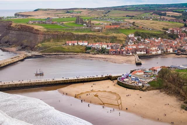 The 60m wide cake which was drawn on to Whitby beach.