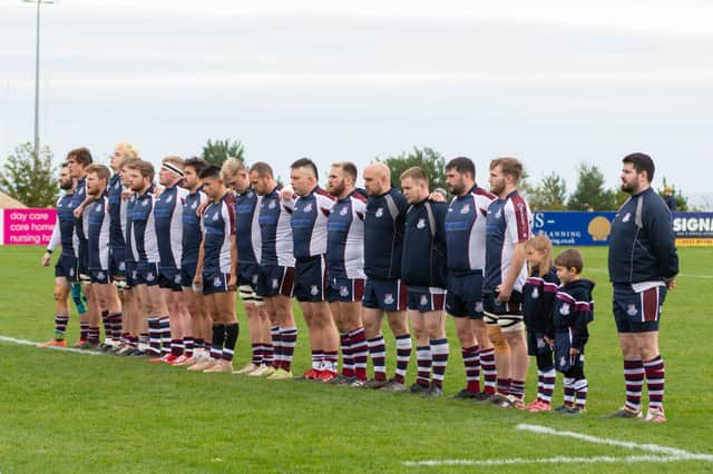 Scarborough RUFC players observe a minute's silence for ex-club president and players Norman Hopkin and Geoff Hill