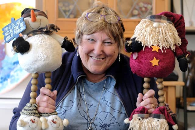 Owner of the Art Room Delia Prudence has organised a Christmas window display for the shopping area