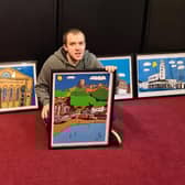 Liam Burke with a selection of his paintings