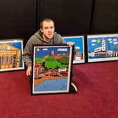 Liam Burke with a selection of his paintings