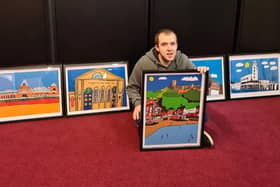 Liam Burke with a selection of his paintings