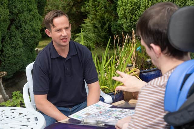 Michael Westlund in conversation in the garden at Milestone House