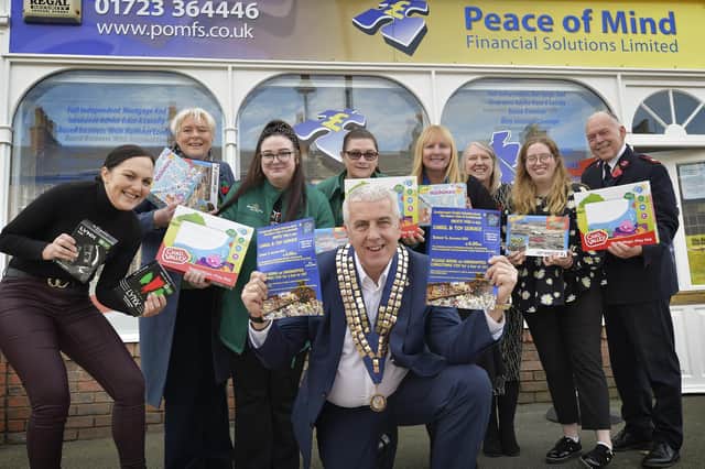 Nigel Wood pictured with local workers Debbie Malton, Cerena Butterworth, Kim Rudge, Maria Collis, Vanessa Rowbottom, Lesleley Webb, Libby Wood and Major Steve Noble.