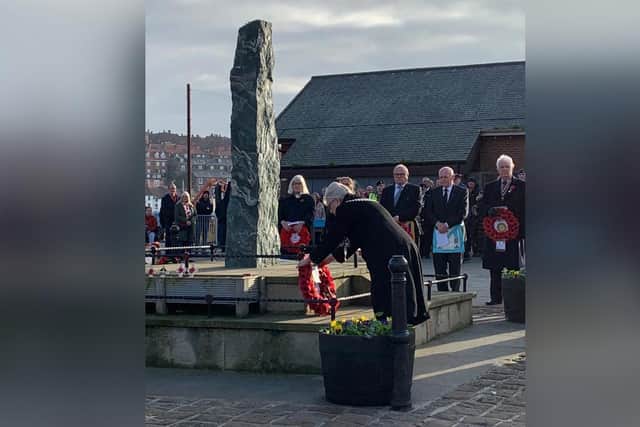 Whitby Mayor Cllr Linda Wild lays a wreath at the Dock End war memorial.